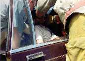 Medics & firefighters keep victims stabilized while top is being removed.